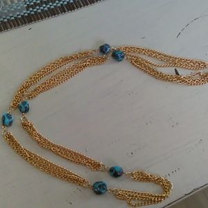 Gold tone necklace with blue beads